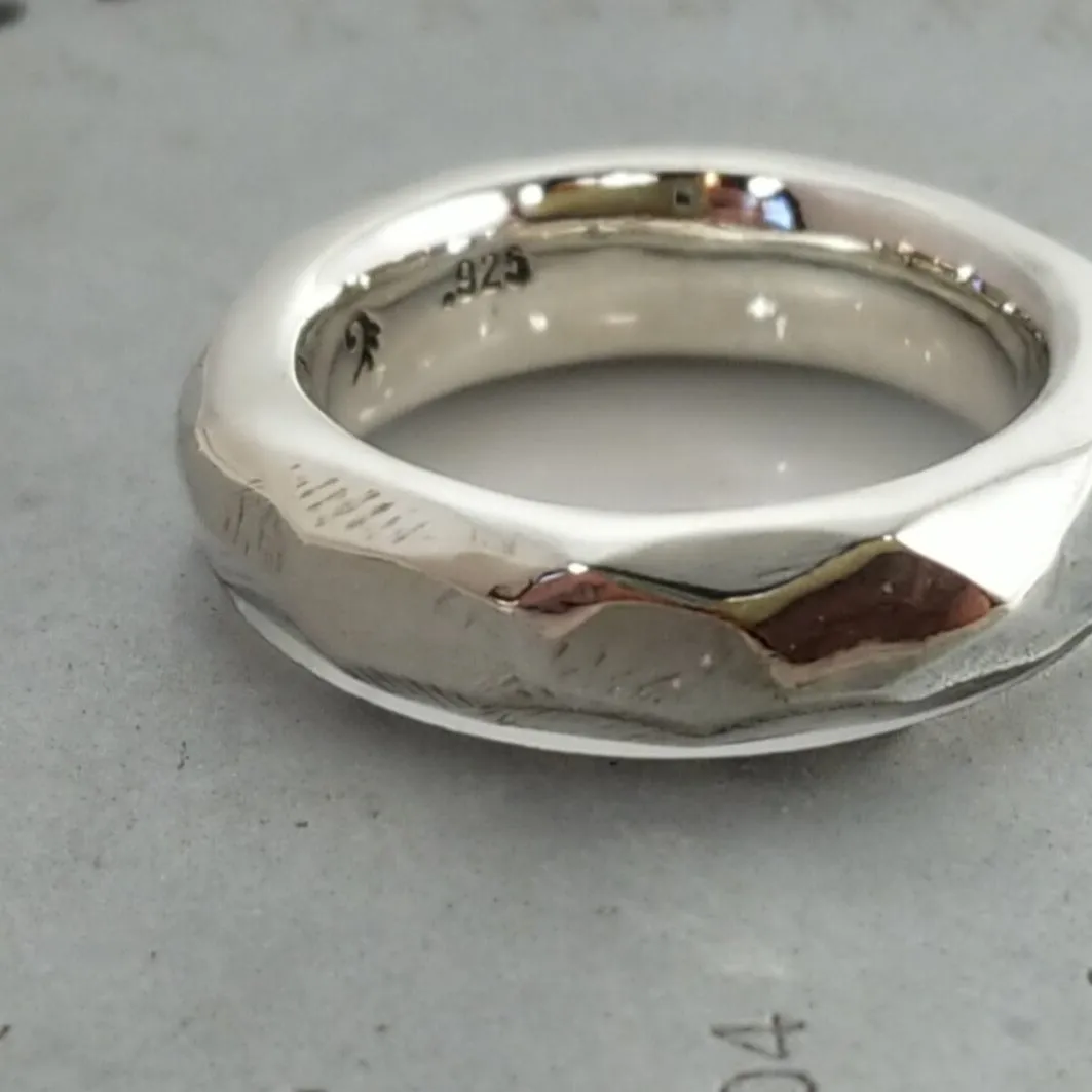 Discover Mr. Edgy: A One-of-a-Kind Solid Silver Ring with a Faceted Surface and Artistic Design
