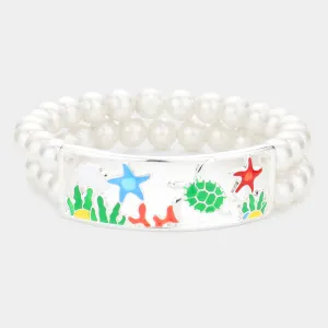 iLLASPARKZ Enamel Starfish Turtle Coral Accented Double Layered Pearl Stretch Bracelet